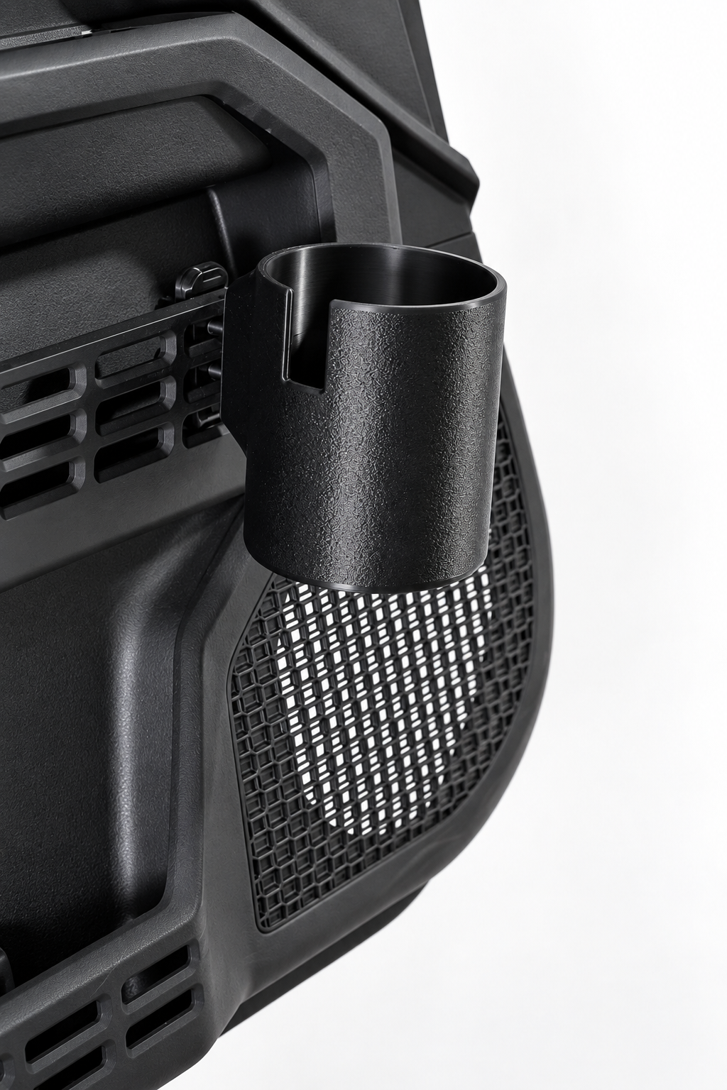 A close-up of a black cylindrical cup holder mounted on Toyota door panel shown against a plain white background.