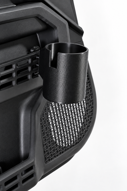 A close-up of a black cylindrical cup holder mounted on Toyota door panel shown against a plain white background.