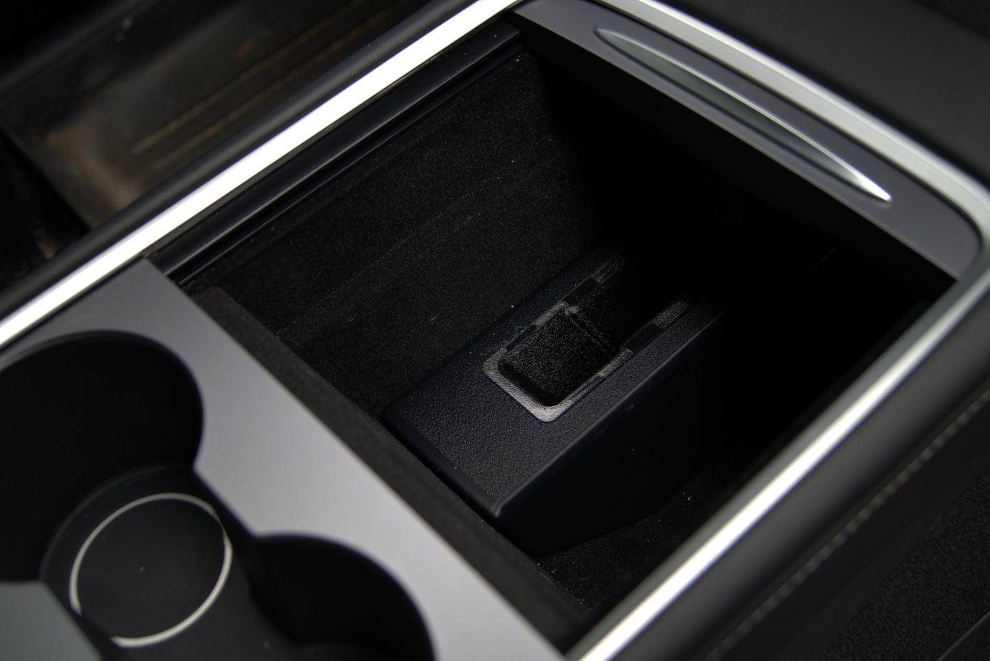 Tesla Model 3 and Model Y center console holster installed in console storage bin