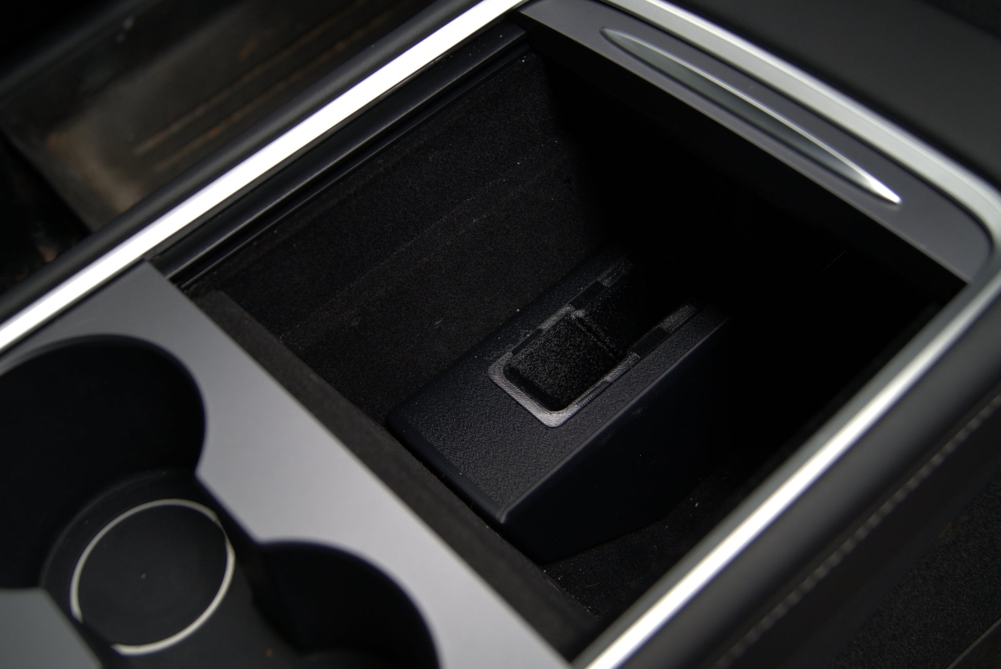 Tesla Model 3 and Model Y center console holster installed in console storage bin