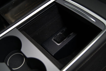 Tesla Model 3 and Model Y center console holster installed in console storage bin