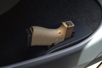 Tesla Model Y door holster installed in driver door pocket
